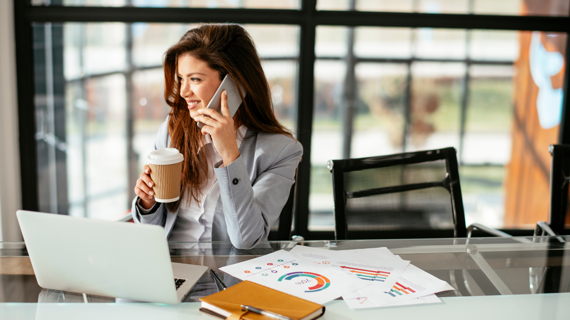 “A determined professional making a cold call at their desk, symbolizing the power of direct communication in driving sales success.”